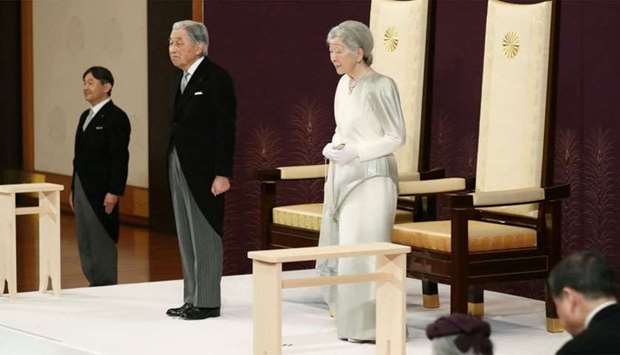 Japanu2019s Crown Prince Naruhito (L), Emperor Akihito (C) and Empress Michiko (R) attend the abdication ceremony at the Matsu-no-Ma state room in the Imperial Palace in Tokyo