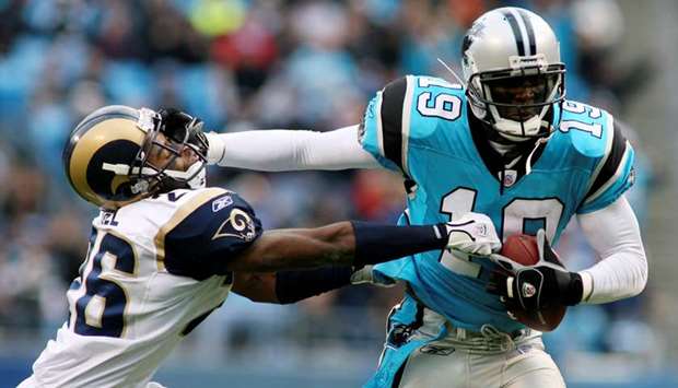 Wide Receiver Keyshawn Johnson of the Carolina Panthers looks on