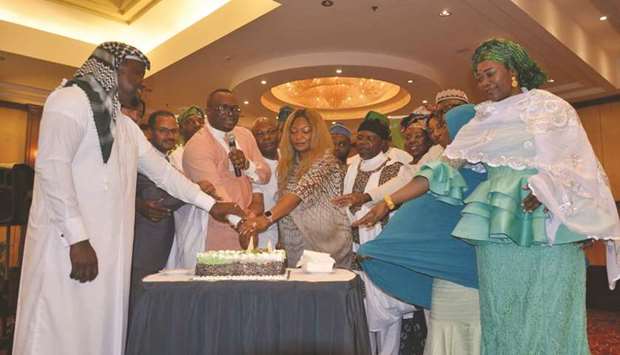 COMMUNITY: Nigerian community members cut Independence Day cake during the countryu2019s 59th anniversary held at the Radisson Blu Hotel in Doha last October.