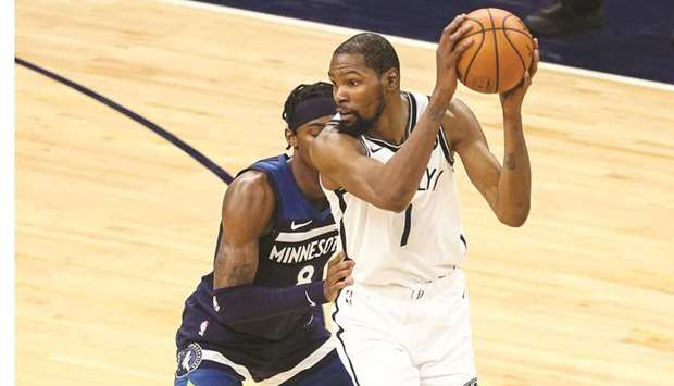 Kevin Durant of the Brooklyn Nets looks to pass against Jarred Vanderbilt of the Minnesota Timberwolves in the third quarter of the game at Target Center in Minneapolis, Minnesota. (Getty Images/AFP)