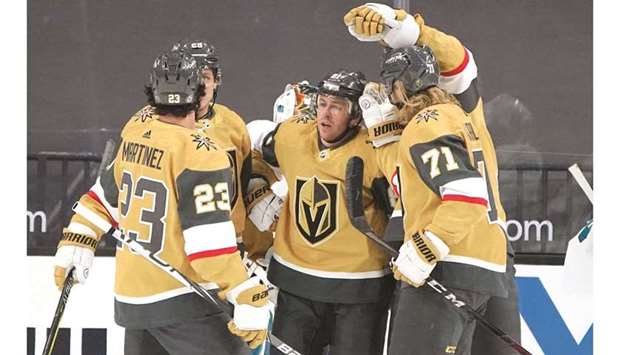 Vegas Golden Knights center Jonathan Marchessault (second right) celebrates after scoring against the San Jose Sharks during the first period of an NHL game at T-Mobile Arena. (USA TODAY Sports)