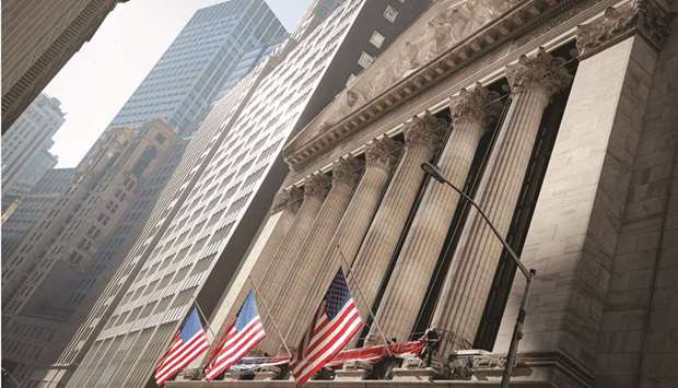 The front facade of the New York Stock Exchange. Some of Wall Streetu2019s biggest names are predicting a pause in a rally that has taken the S&P 500 to fresh records this year, leaving investors trying to determine whether to lock in some of the breathtaking gains or stay the course.