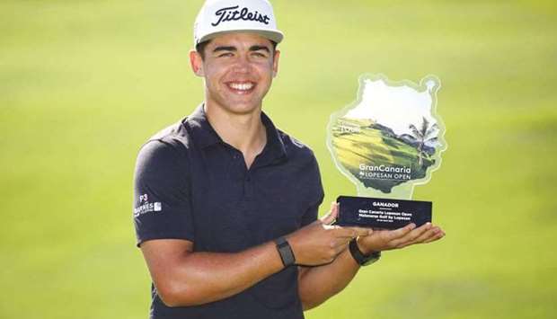 South Africau2019s Garrick Higgo poses with trophy after winning the Gran Canaria Open.