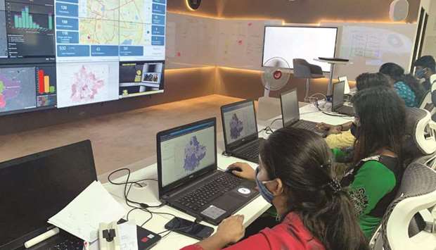 Software professionals assisting municipal authorities work on their terminals inside a u201cwar roomu201d focused on tracking the spread of the coronavirus disease at the Bruhat Bengaluru Mahanagara Palike office in Bengaluru, India (file).