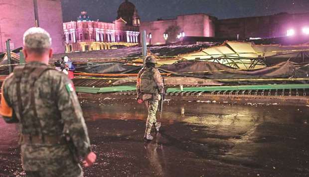 Soldiers are seen near to the Aztec archaeological zone of u2018Templo mayoru2019, which collapsed following heavy rain, in Mexico City.