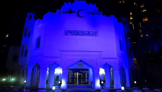 QRCS premises lit up in blue.