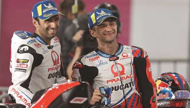 (L to R) Pramac Racing's French rider Johann Zarco and Pramac Racing's Spanish rider Jorge Martin pose for a picture during the Moto GP Grand Prix of Doha at the Losail International Circuit, in the city of Lusail