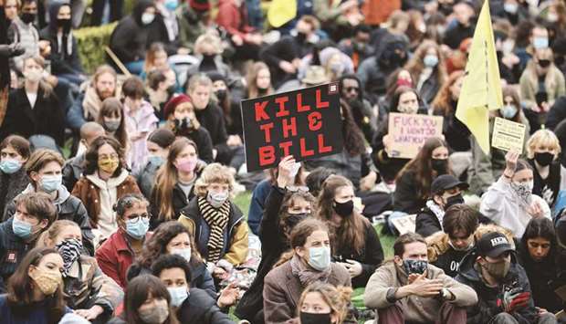 Protestors hold placards during a u2018Kill The Billu2019 protest against the Governmentu2019s Police, Crime, Sentencing and Courts Bill, in Parliament Square, central London yesterday. AFP