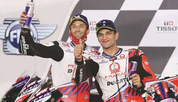 Pramac Racing's French rider Johann Zarco (L) and Pramac Racing's Spanish rider Jorge Martin celebrate their podium positions after the Moto GP Grand Prix of Doha at the Losail International Circuit, in the city of Lusail on April 4, 2021