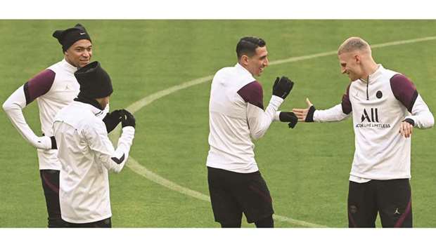 From Left:  Paris Saint-Germainu2019s Kylian Mbappe, Neymar, Angel Di Maria and Mitchel Bakker joke during a training session in Munich yesterday. (AFP)