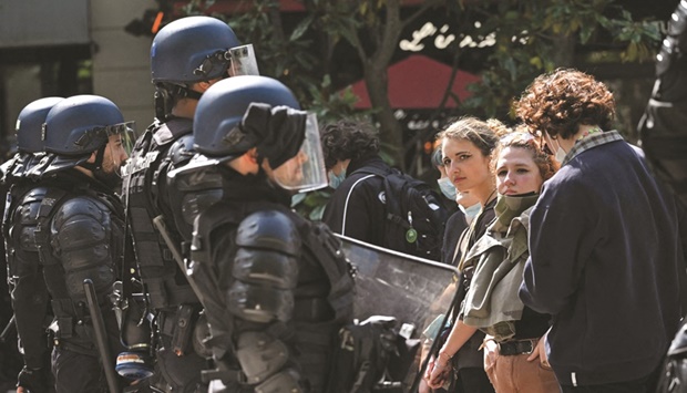 Students face police officers as they gather for a demonstration in front of Parisu2019s Sorbonne University, 10 days ahead of the second round of Franceu2019s presidential election.