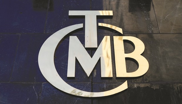 A logo of Turkeyu2019s central bank is pictured at the entrance to its headquarters in Ankara (file). The bank held its policy rate at 14% for a fourth consecutive month on Thursday as expected, even as inflation is predicted to exceed 70% after Russiau2019s invasion of Ukraine sent energy prices soaring.