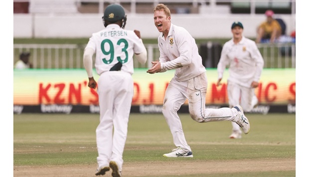 South Africau2019s fast bowler Simon Harmer celebrates after the dismissal of Bangladeshu2019s Mushfiqur Rahim (not in the picture) during the second day of the first Test at the Kingsmead Stadium in Durban yesterday. (AFP)