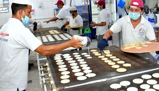 Workers busy at an eatery. PICTURE: Thajudheen