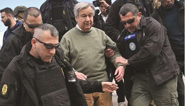 UN Secretary-General Antonio Guterres (centre) walks surrounded by security personnel during his visit in Borodianka, outside Kyiv, yesterday. (AFP)