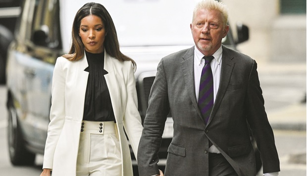 Former tennis star Boris Becker arrives with his partner Lilian de Carvalho Monteiro at Southwark Crown Court in London yesterday to face sentencing after being found guilty of four charges relating to his 2017 bankruptcy. (Reuters)