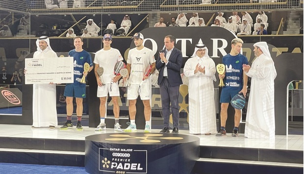 HE Abdullah bin Abdulaziz bin Turki al-Subaie, Minister of Municipality, Sheikh Mohamed bin Abdullah al-Thani, CEO of Ooredoo Qatar, Tariq Zainal, Secretary-General of QTSBF and Luigi Carraro, President of the International Padel Federation pose with the Ooredoo Qatar Major 2022 winners Francisco Navarro and Martin Di Nenno and runners-up Juan Lebron and Alejandro Galan at the Khalifa International Tennis Complex yesterday.