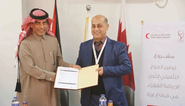 Dr Khaled Abdulhadi and Dr Akram Nassar after signing the agreement.