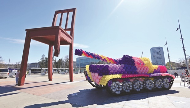 A life-size tank, entirely made with inflatable balloons of biodegradable latex, is seen during the launch of the u2018Stop Bombing Civiliansu2019 campaign by Handicap International in front of the United Nations, and next to the Broken Chair sculpture, in Geneva.