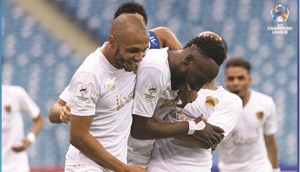 Al Rayyanu2019s Yohan Boli (centre) celebrates with teammates after scoring the winner against FC Istiklol in the AFC Champions League Group A match at King Fahd International Stadium in Riyadh yesterday.