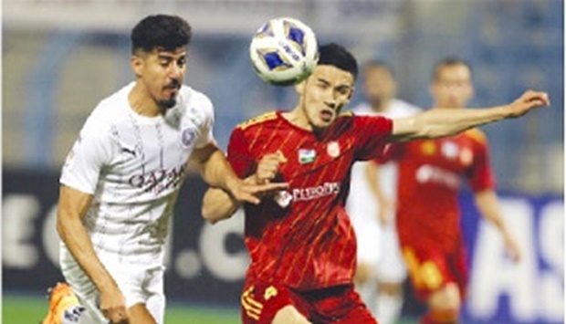 Al Saddu2019s Baghdad Bounedjah (left) and Nasafu2019s Husniddin Aliqulov vie for the ball during the AFC Champions League Group E match at the Prince Mohamed bin Fahd in Dammam, Saudi Arabia, on Friday.