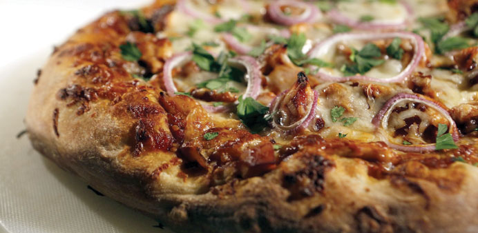 Barbecue chicken pizza can be incorporated into a rotisserie chicken dinner. 