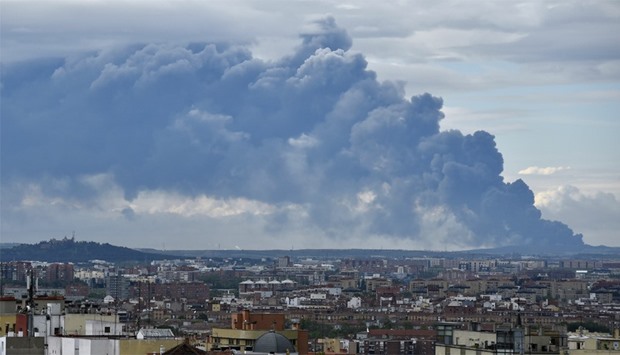 Huge smoke column caused by a fire in an uncontrolled dump near the town of Sesena