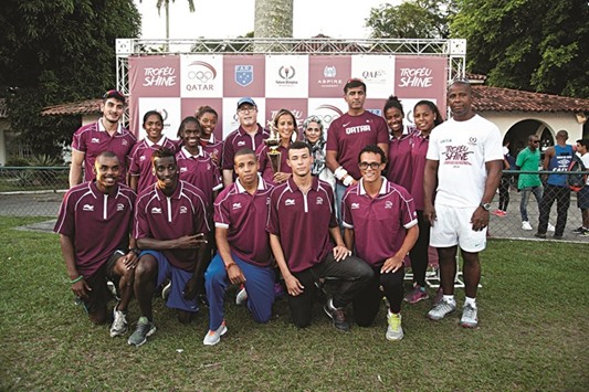 Shine winners celebrate with QOC officials and ambassadors in Rio de Janeiro, Brazil.