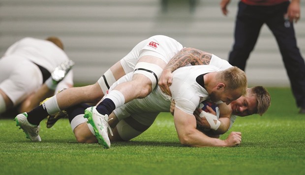 Matt Kvesic and Teimana Harrison of England take part in a training session in Bagshot, Surrey, yesterday. (Reuters)