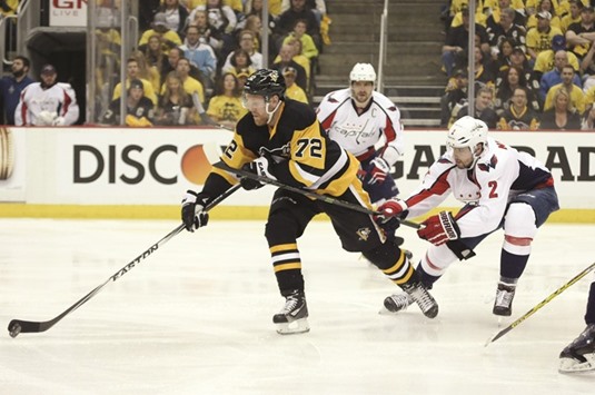 Pittsburgh Penguins' Patric Hornqvist (left) carries the puck against Washington Capitals' Matt Niskanen (2) during game four of the second round of the 2016 Stanley Cup Playoffs in Pittsburgh, Pennsylvania, on Wednesday. (USA TODAY Sports)