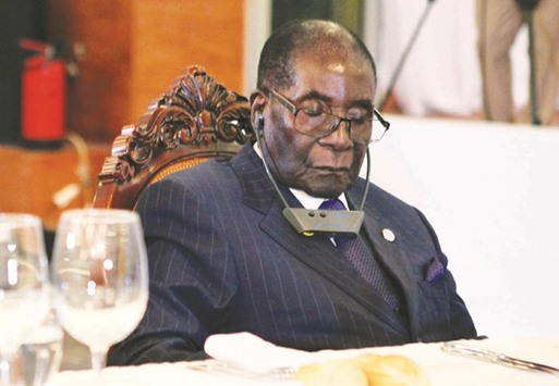 This file photo taken on January 13 shows Mugabe attending a state dinner. Mugabe, 93, is not asleep when he closes his eyes for long periods in public events but is resting his eyes from bright lights, his spokesman said yesterday.