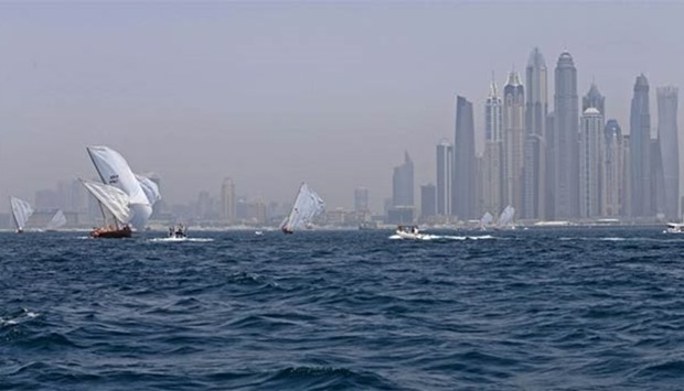 Dhows participate in the Al-Gaffal traditional long-distance dhow sailing race near the finish line off Dubai, on Sunday.