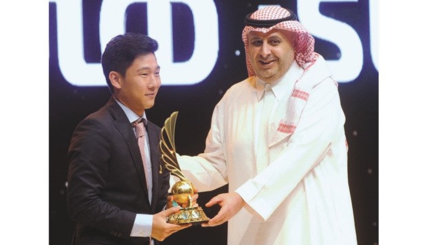 Lekhwiya midfielder Nam Tae-hee receiving the QFA player of the year award.