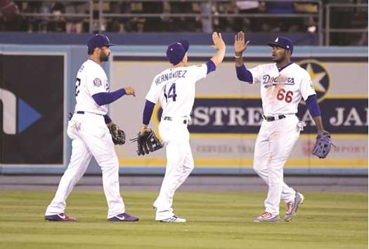 Los Angeles Dodgers Enrique Hernandez (14) scores on a groundout