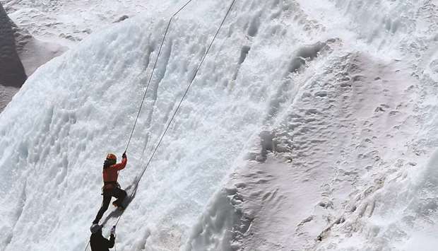 Climbers at Everest Base Camp practising their techniques on the Khumbu glacier before trying to summit Everest, some 140km northeast of the Nepali capital Kathmandu.