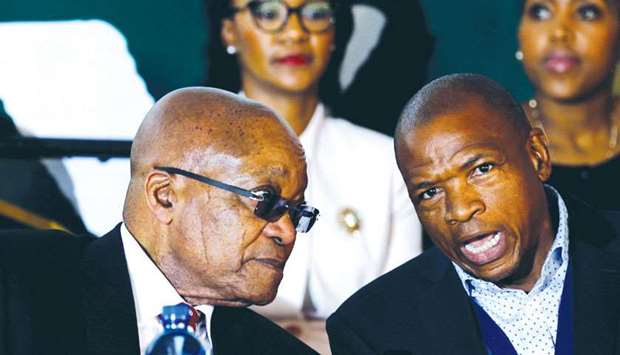 File photo shows South Africau2019s former president Jacob Zuma chatting with Premier of North West Province Supra Mahumapelo before addressing the National Youth Day commemoration, in Ventersdorp.