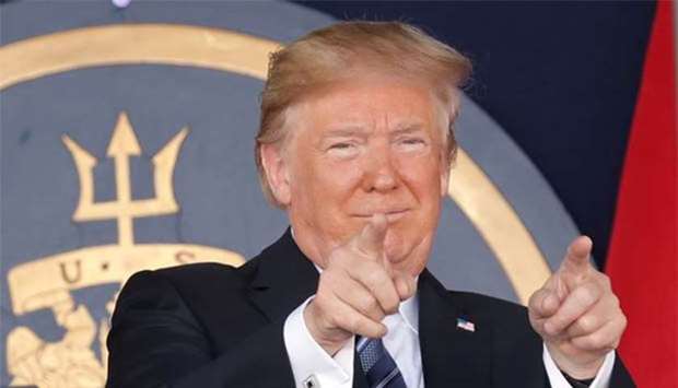 President Donald Trump gestures as he speaks at the commissioning and graduation ceremony for US Naval Academy Class of 2018 at the Navy-Marine Corps Memorial Stadium in Annapolis, Maryland, on Friday.