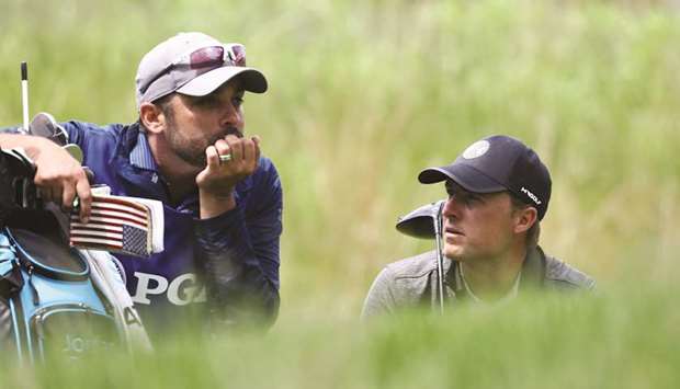 Jordan Spieth of the United States and caddie Michael Greller wait to tee off on the fourth hole during the second round of the 2019 PGA Championship yesterday.