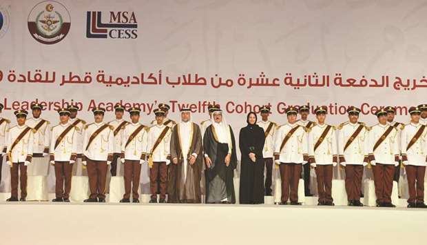 HE Dr Hamad bin Adbulaziz al-Kuwari, Buthaina Ali al-Nuaimi and Staff Brigadier General Ali bin Ahmed al-Kuwari with the graduates. PICTURES: Noushad Thekkayil