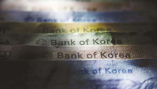 South Korean won banknotes of various denominations are arranged for a photograph in Seoul. The currency, Asiau2019s worst performer this year, may keep slipping until it hits 1,200 against the dollar as growth concerns and disappointment over the size of a supplementary budget sap confidence, said Choi Kyungjin, head of fixed income and currencies at Deutsche Bank in Seoul.