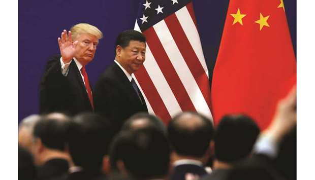Chinau2019s President Xi Jinping and US President Donald Trump meet business leaders at the Great Hall of the People in Beijing (file). Trade tensions between Washington and Beijing escalated sharply this month after the Trump administration accused China of having reneged on its previous promises to make structural changes to its economic practices.