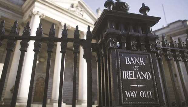A sign at the Bank of Ireland directing traffic reads u2018Way Outu2019 and is seen on the railings outside an entrance to the bank on Dame Street in Dublin. Bank of Ireland is offering Europeu2019s highest-paying bank CoCo bond in several months, joining a clutch of deals from junk-rated firms testing investor appetite for risk following the coronavirus turmoil.