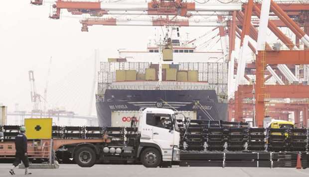 A container is loaded onto the MSC Rafaela container ship, operated by Mediterranean Shipping Company, at a shipping terminal in Yokohama. Analysts see the Japanese economy shrinking at an annualised pace of 4.5% in the first three months of this year.