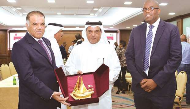 RECOGNITION: Qatar Chamber board member Mohamed bin Ahmed al-Obaidli hands over a token of recognition to South African ambassador Faizel Moosa after a business meeting between Qatari private sector stakeholders and a delegation led by Harold Manamela of South Africau2019s Department of Trade and Industry.