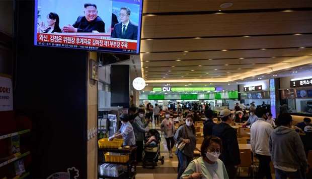 A television screen shows a news broadcast with an image of North Korea's leader Kim Jong Un at a service station near Gapyeong