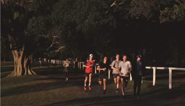 People exercise in Centennial Park amidst the easing of restrictions implemented to curb the spread of the coronavirus disease (Covid-19) in Sydney, Australia, yesterday.