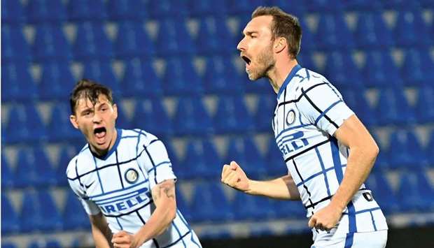 Inter Milanu2019s Christian Eriksen (right) celebrates after scoring against Crotone during the Italian Serie A match yesterday. (AFP)