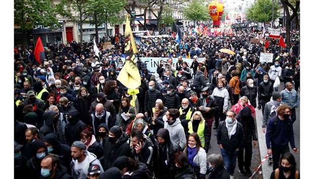 People attend the traditional May Day labour union march, amid the coronavirus disease (COVID-19) outbreak in Paris, France on Saturday. (Reuters)