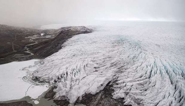 Ice receding from a glacier is seen from an aerial helicopter tour near Kangerlussuaq