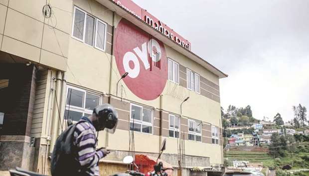 The logo of Oyo, operated by Oravel Stays, is displayed outside a hotel in Ooty, India. Oyo Hotels, one of Indiau2019s most valuable startups, is offering unusually generous terms to investors as it seeks to raise $600mn in debt, following a fresh surge of coronavirus cases in its home country that decimated travel and undercut its recovery plans.